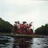 Neil Peart plays drums on lake (side)