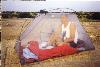 Neil in a tent in Africa
