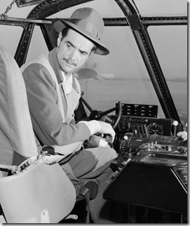 Hughes behind the controls of the Hercules