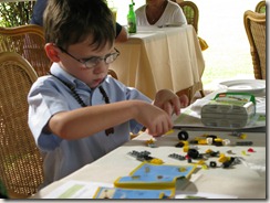 Drew assembles a Lego car